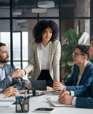 Business handshake in a team meeting